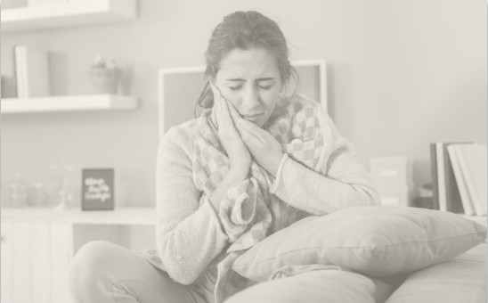 woman holding mouth in pain in Parsippany-Troy Hill